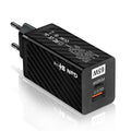 Compact white GaN 65W laptop charger with UK plug next to ruler showing 38mm width