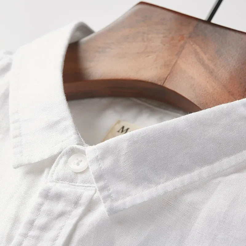 Men's light blue linen square collar casual short sleeve shirt laid flat
