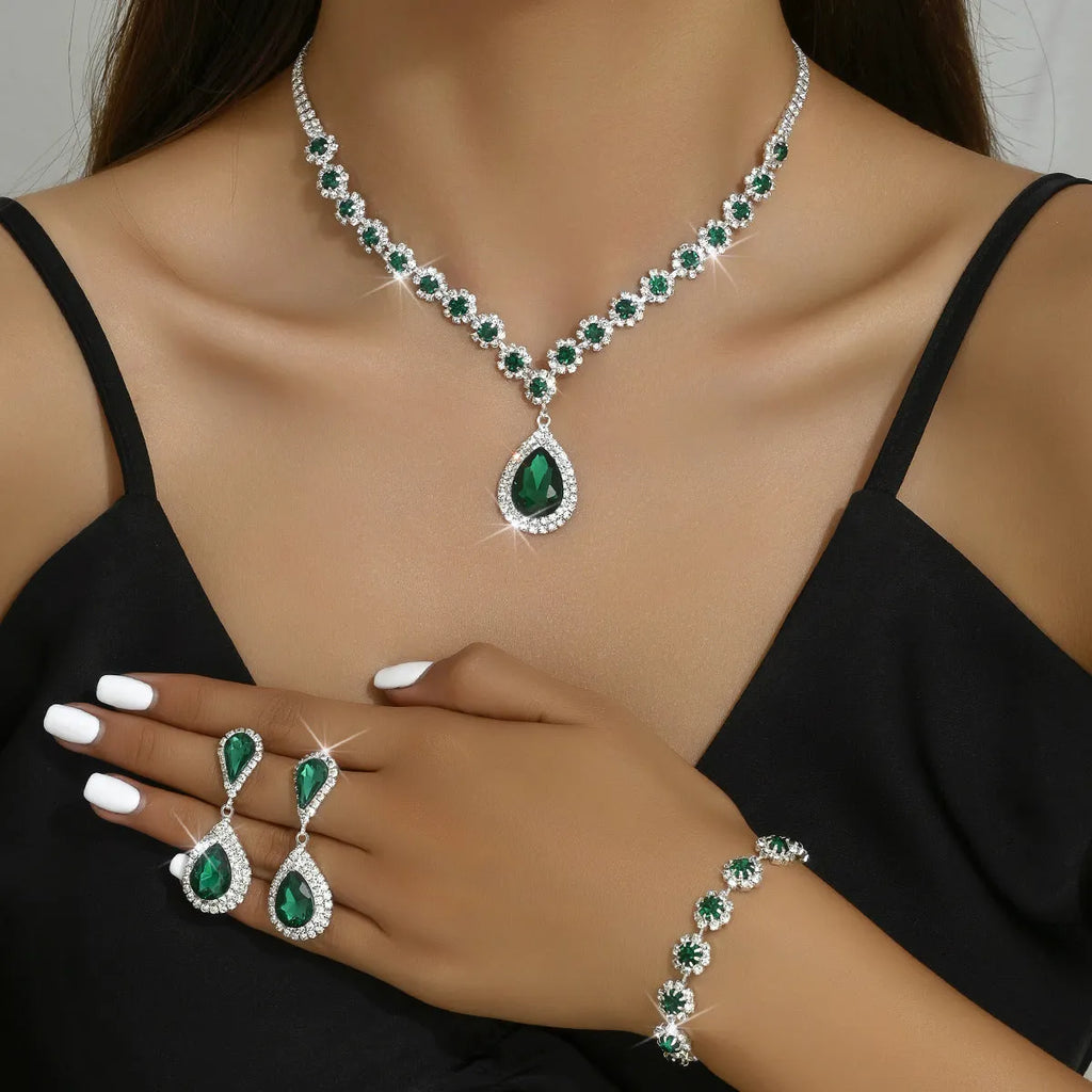 Rhinestone three-piece jewellery set with necklace, ear studs and bracelet in white, sapphire blue, red or hole green