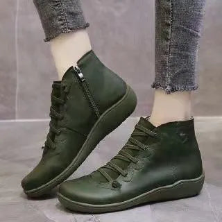 Women's casual flat boots with a wedge heel and round toe in various colours.