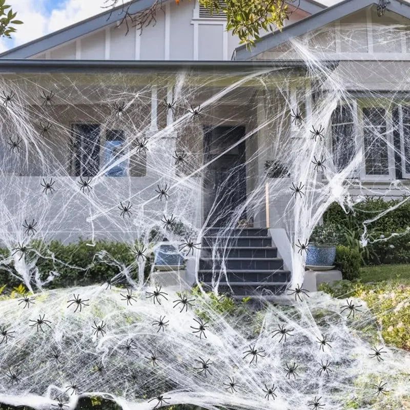 White cotton spider web Halloween decorations showing various weight packages with included plastic spiders