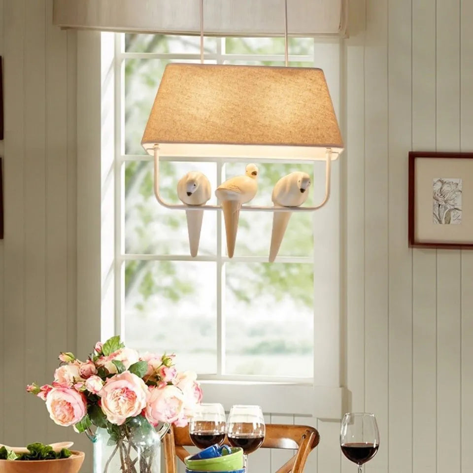 Iron and fabric bird chandelier ceiling lamp with decorative bird silhouette shade.