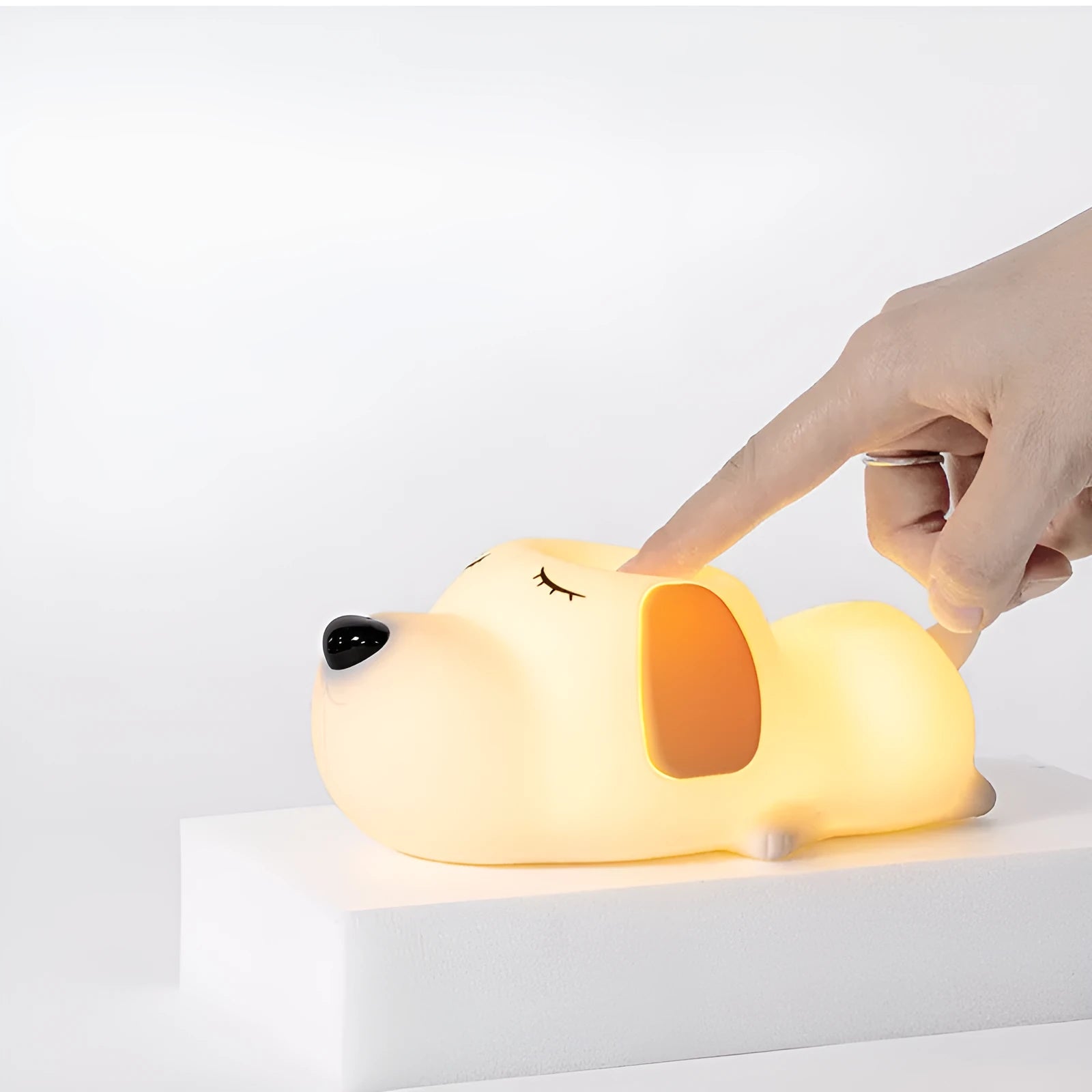 Silicone cartoon dog night light with two-tone design, shown with USB charging cable.