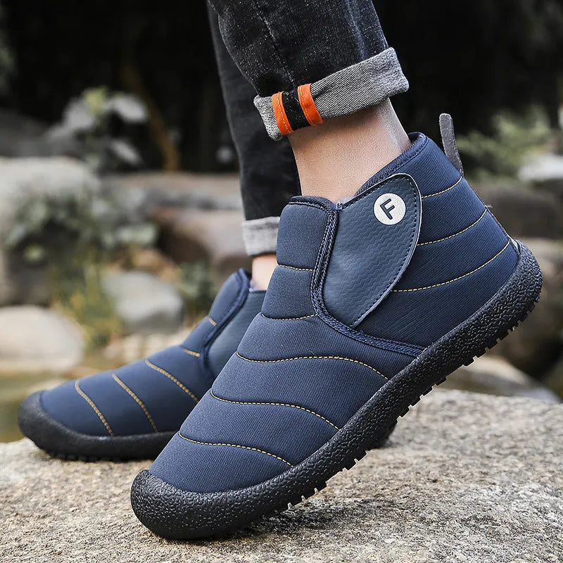 Men's waterproof snow boots in black with non-slip rubber sole and plush lining