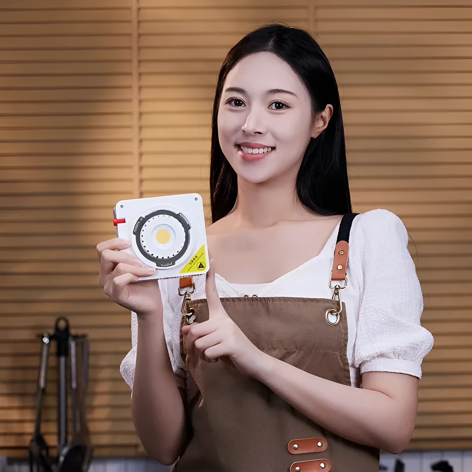ML100Bi aluminium alloy photography LED fill light with lenses and battery handle on a stand.