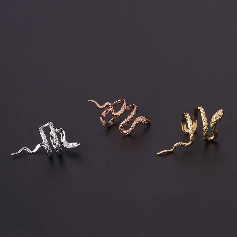 Metal snake-shaped ear clip non-piercing earring in silver finish on earlobe