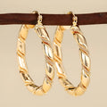 Geometric copper earrings with ring and line design elements in golden finish for women