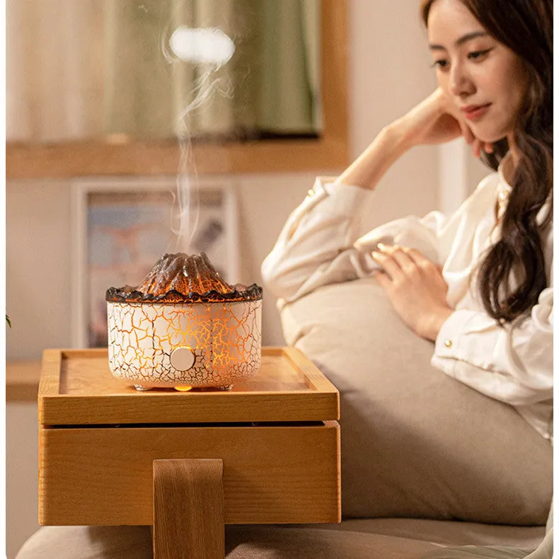 Volcano-shaped humidifier diffuser with LED flame lighting effect emitting mist puffs