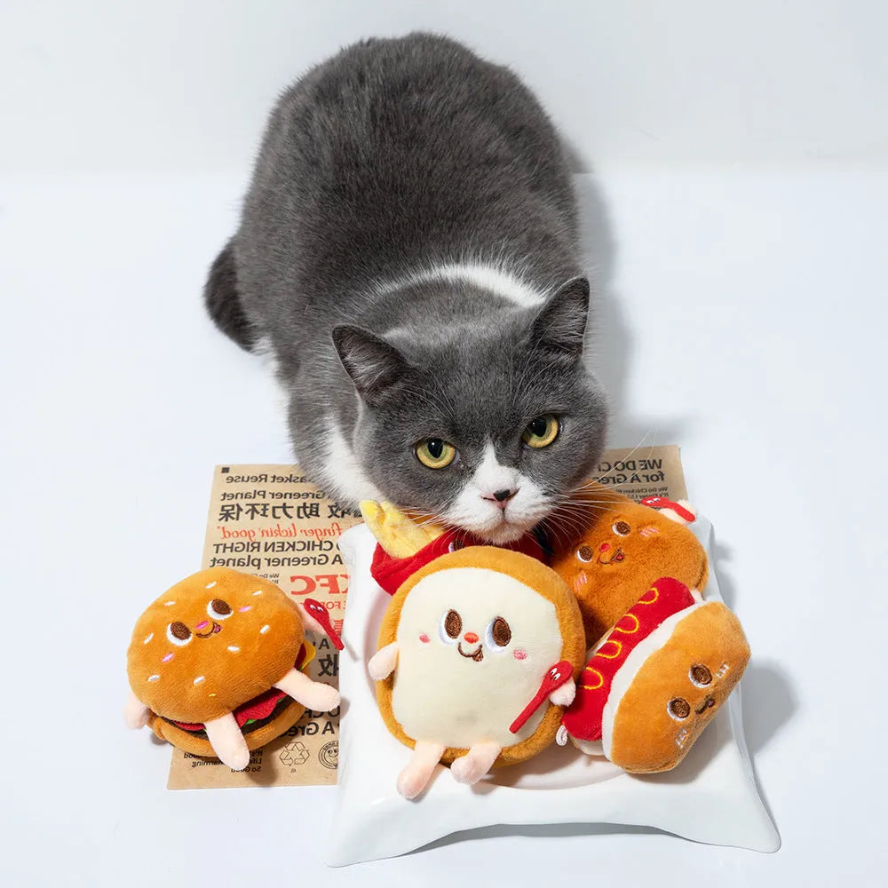 Set of five food-shaped cat chewing toys showing hamburger, chicken legs, fries, bread and hot dog designs