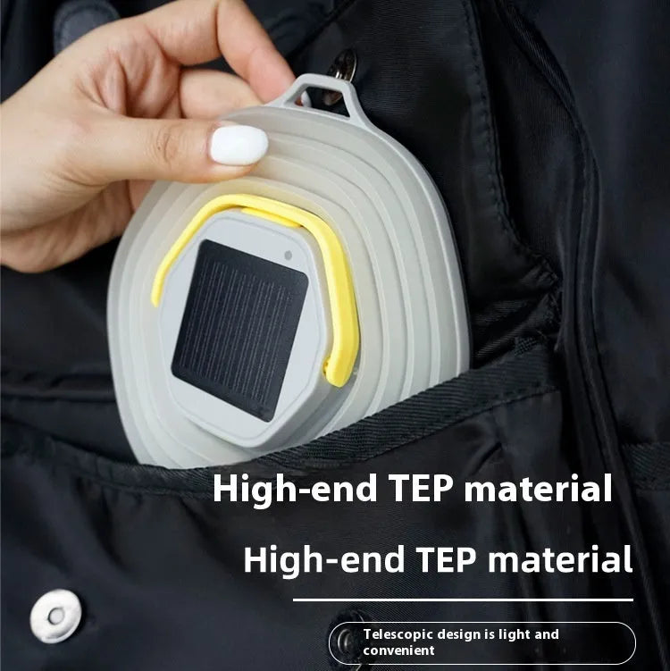 White portable camping lamp with a large capacity battery and a single control button.