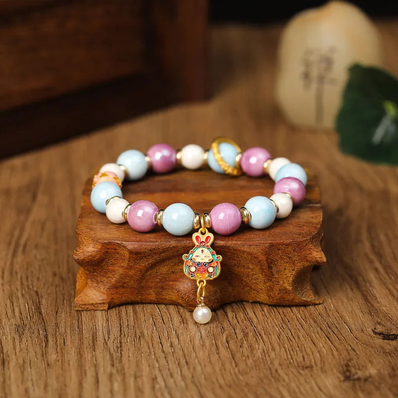 Lucky Rabbit handmade ceramic bracelet with gray porcelain glaze on an adjustable cord.