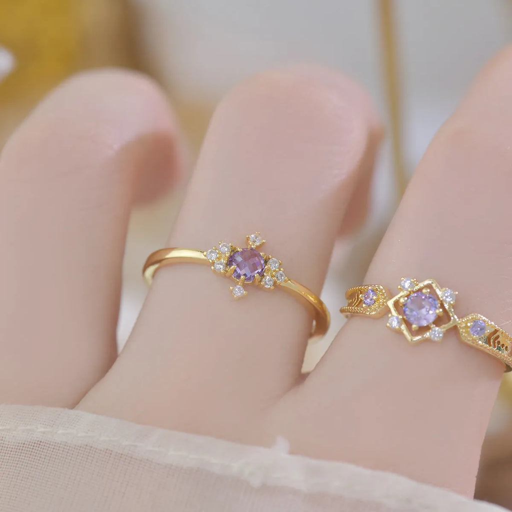 Open mouth geometric ring with round zircon stones on copper band, available in purple or olive green