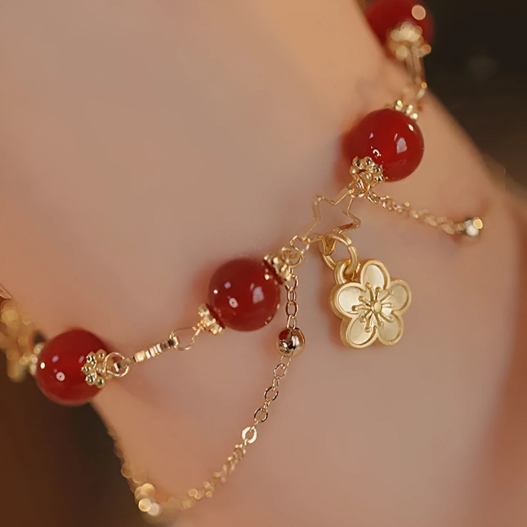 Women's red agate bracelet with double layer design and floral charms