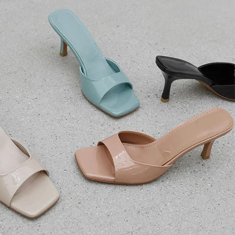 Square toe stiletto heel sandals in nude colour with rubber sole on white background