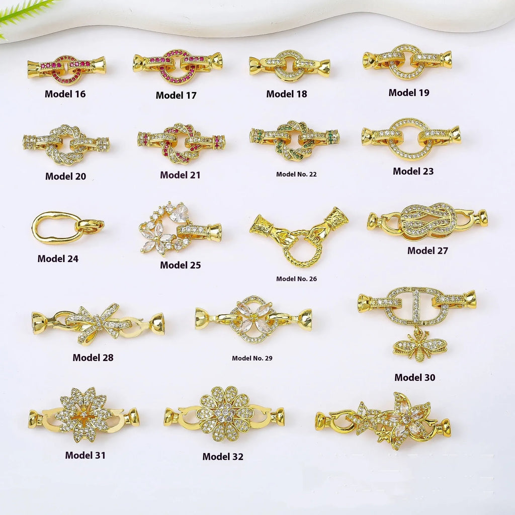 Small gold-coloured jewellery clasp with a closed loop, isolated on white background.