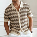 Yellow short-sleeve sweater with a raised corrugated jacquard pattern and a flocked detail on the front.