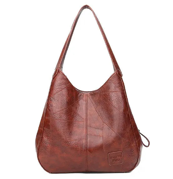 Vintage women's large PU shoulder tote bag in solid colour with double straps and magnetic buckle closure.