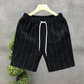 Men's black and white striped fleece-lined casual shorts showing straight leg and ankle band design.
