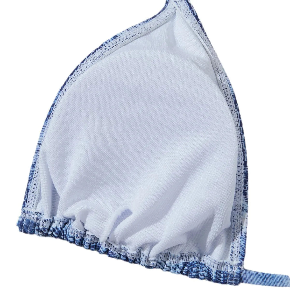 Women's denim blue printed bikini set with adjustable straps on a mannequin.