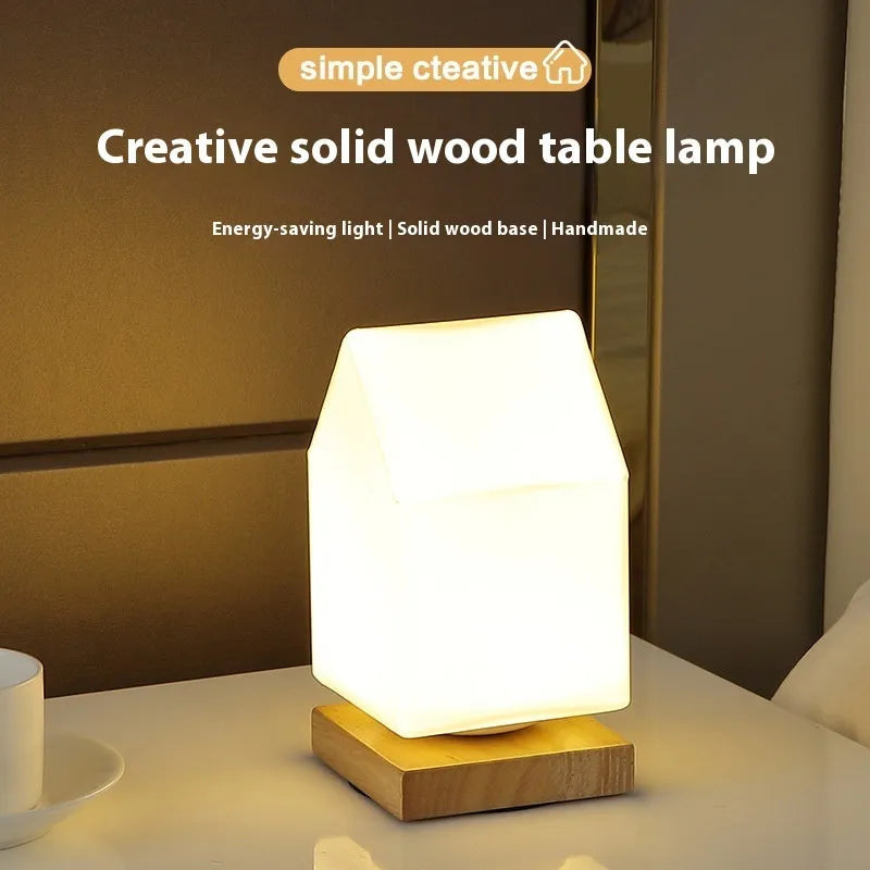 Nordic USB table lamp with geometric white light and solid wood decoration on bedside table