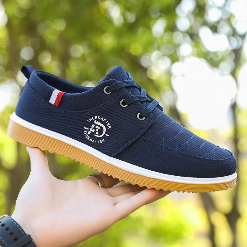 Men's black canvas casual shoes with leather toe cap and non-slip platform sole.