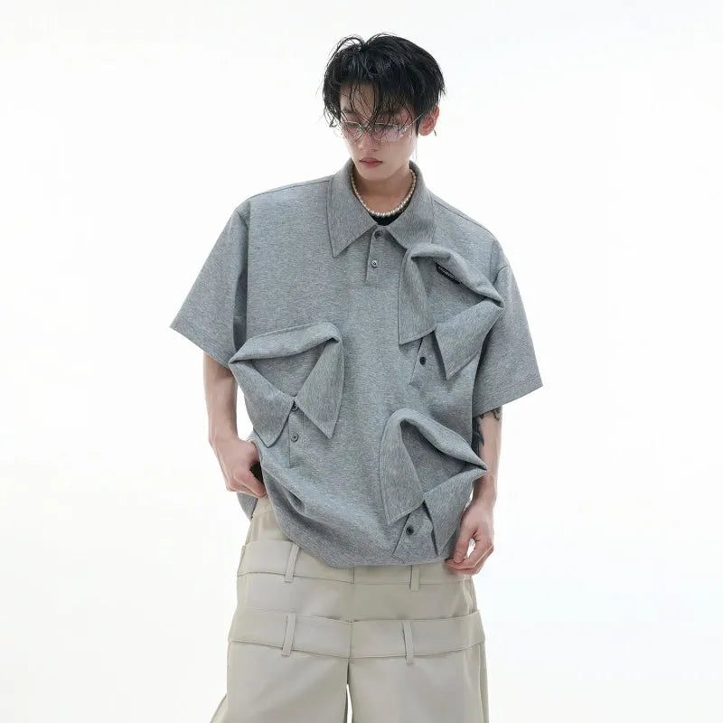 Men's loose fit polo shirt with deconstructed shirt collar and geometric pattern in grey.