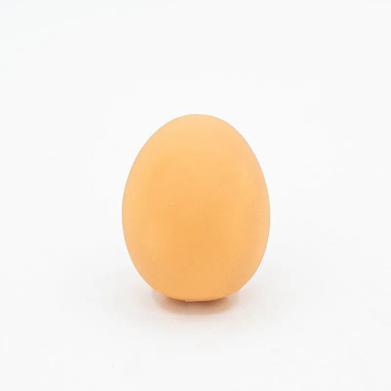 Egg-shaped dog toy with sound effects for chewing and dental care