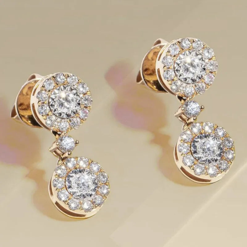 Women's gold copper round zircon stud earrings on a light background