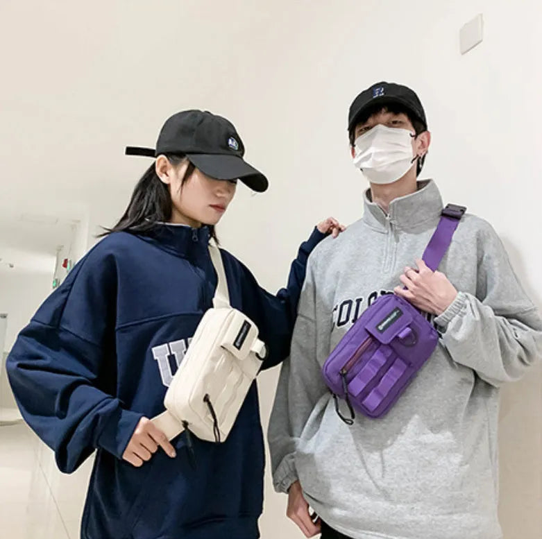 Tooling style crossbody bag in solid colour with wear-resistant nylon for outdoor sports use, below 20L capacity