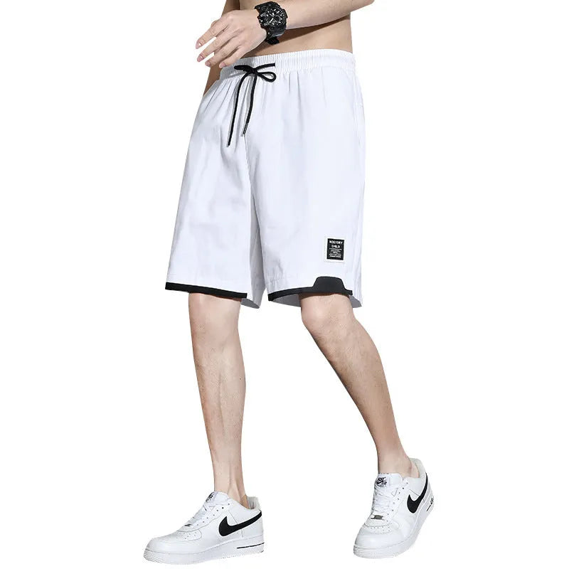Boy wearing khaki cotton shorts with mid-waist, showing front view.
