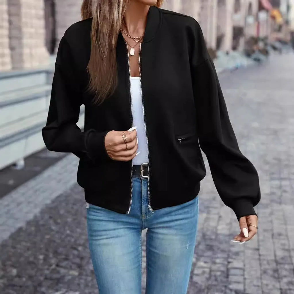 Black women's casual zip jacket with long sleeves and faux pocket detail.