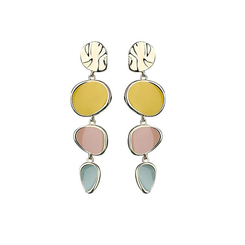 A pair of simple disc-shaped earrings with a morandi three-colour oil-drip finish and sterling silver posts.