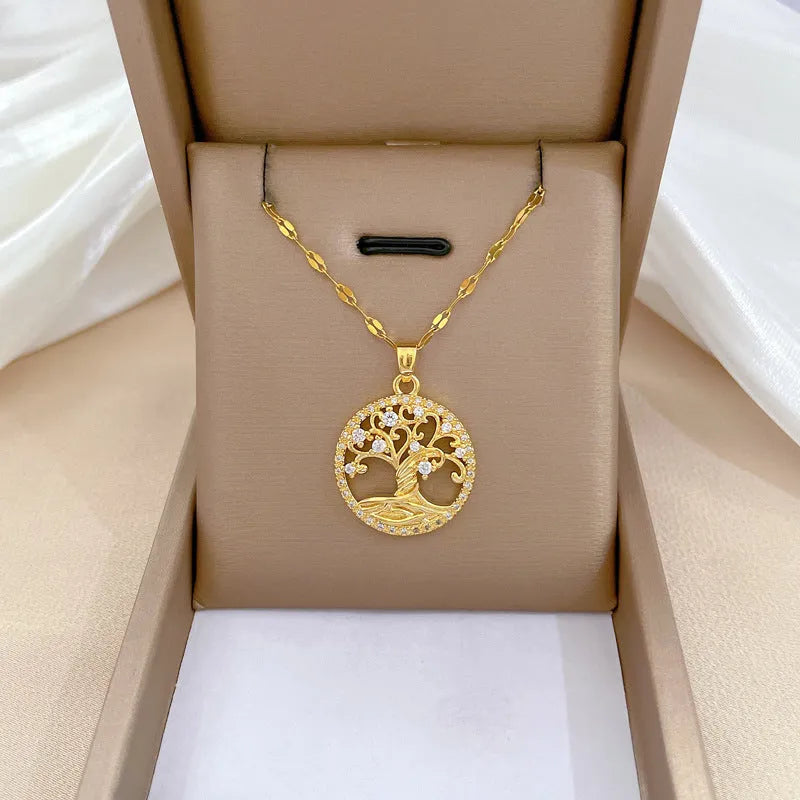 Gold-plated cross necklace with a mother-of-pearl centre and inlaid rhinestones on a lip chain.