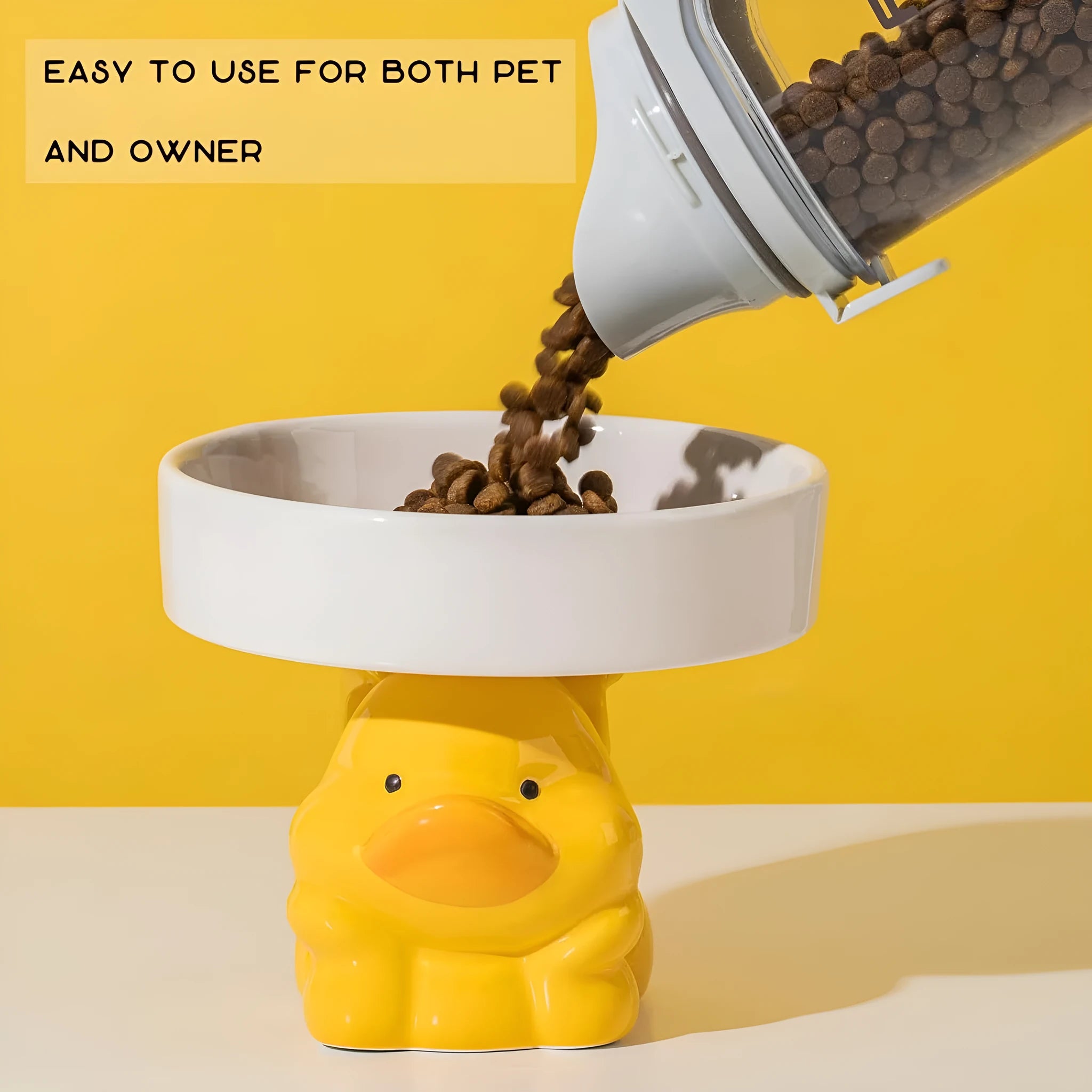 Raised ceramic cat food bowl in an animal theme design on a white background