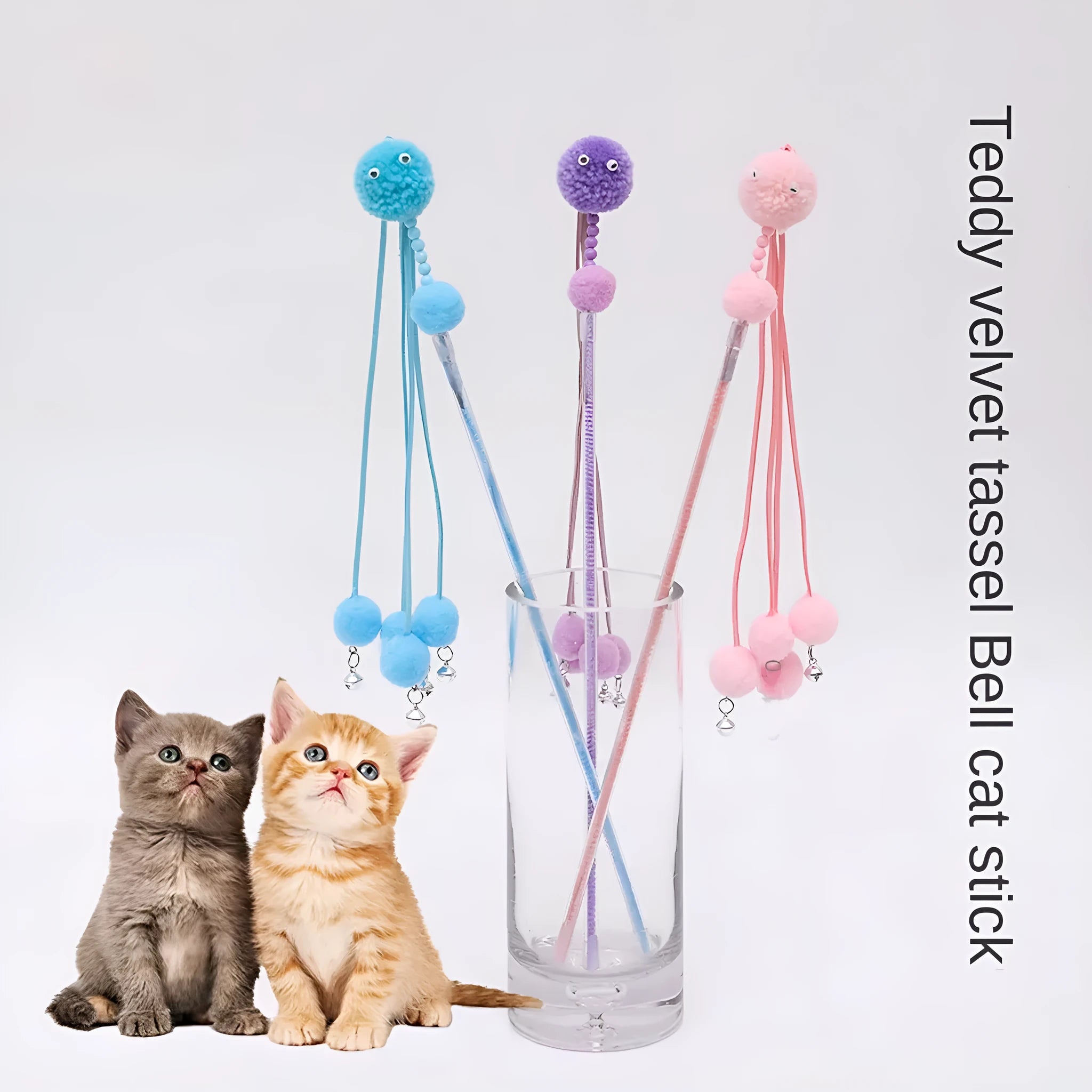 Blue cat toy wand with a fluffy tassel on a stick for interactive pet play.