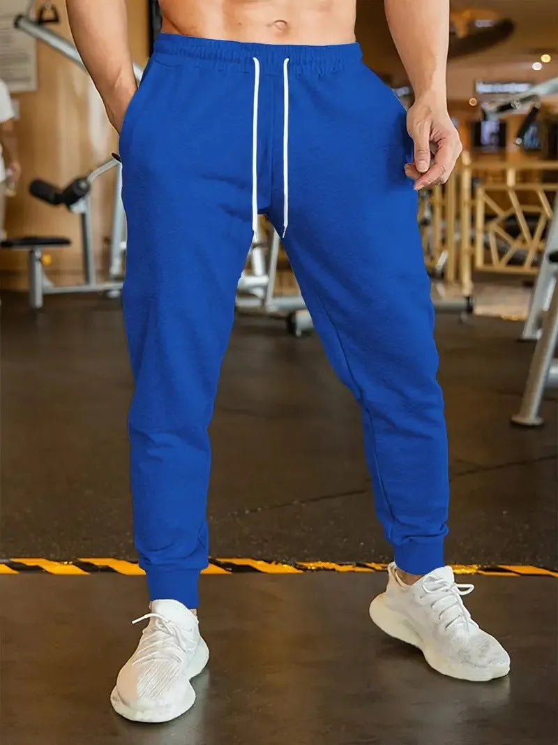 Men's polyester linen leisure trousers with drawstring waist and elasticated calf in loose fit design