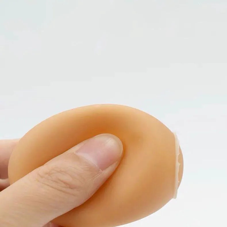 Egg-shaped dog toy with sound effects for chewing and dental care