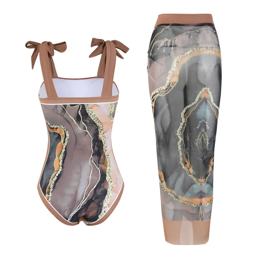 Floral print conservative one-piece swimsuit with mesh tube top and matching skirt.