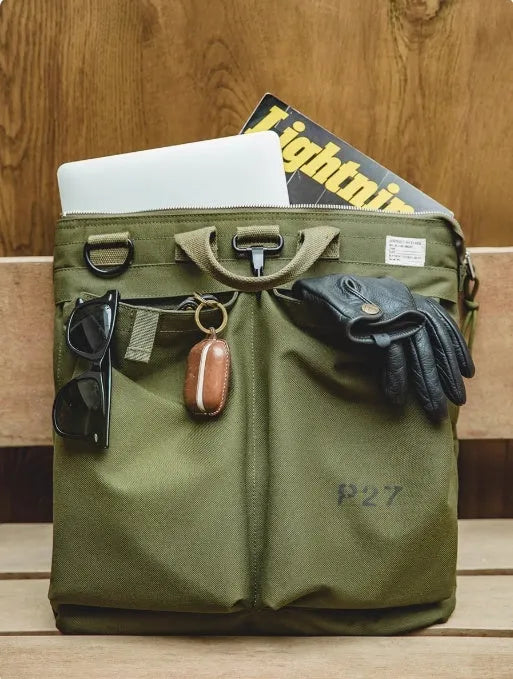 Medium canvas crossbody messenger bag in military green colour with laptop compartment and phone pocket