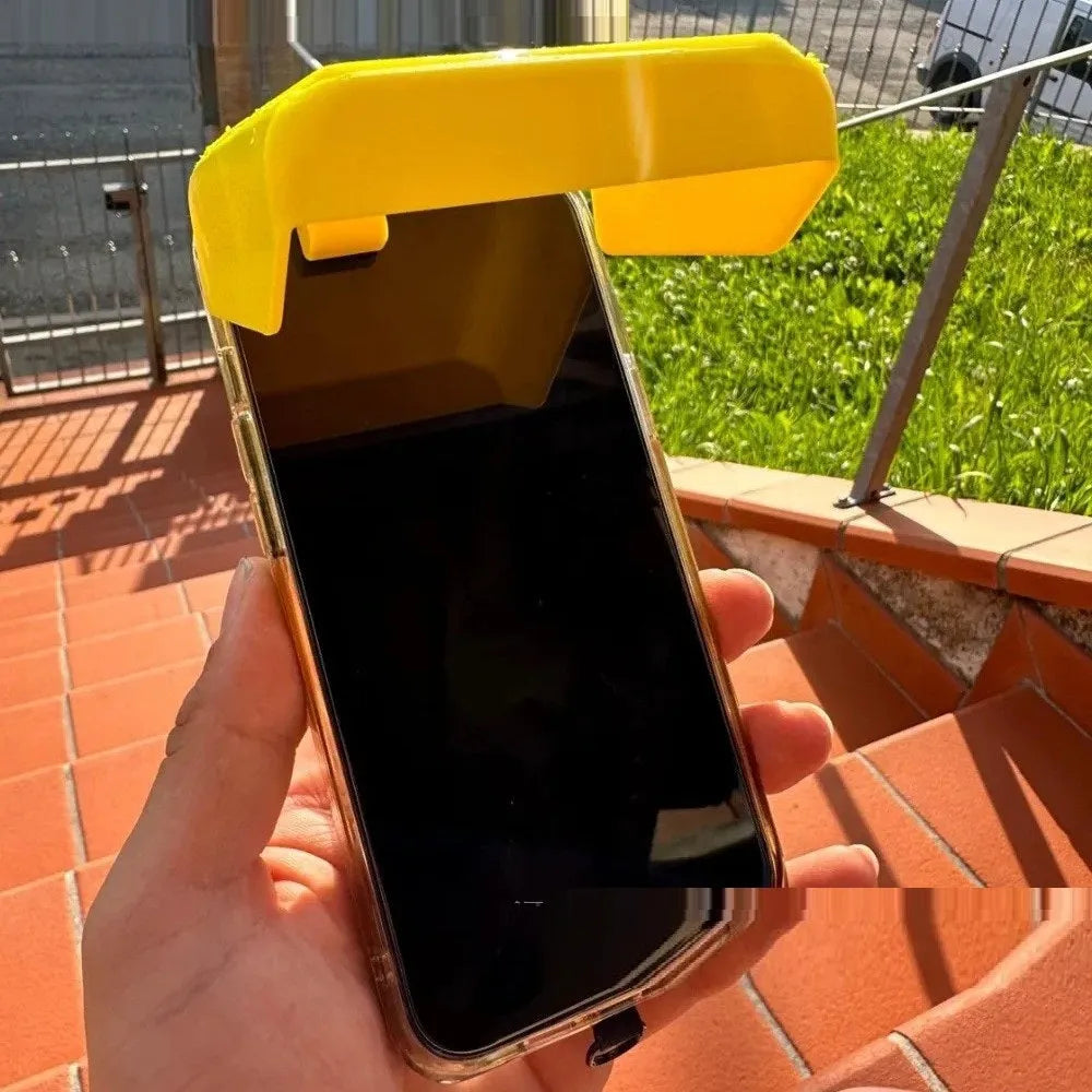 Yellow plastic phone sunshade clip attached to pool float with phone visible