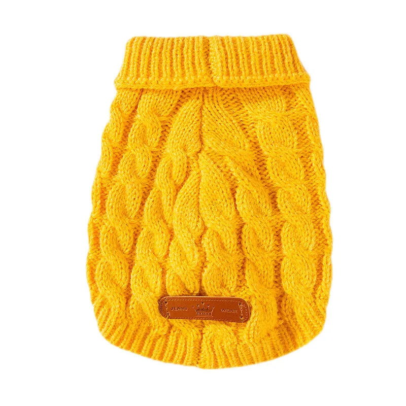 Dog wearing a simple twisted knitted sweater in autumn winter colours for small to medium dogs