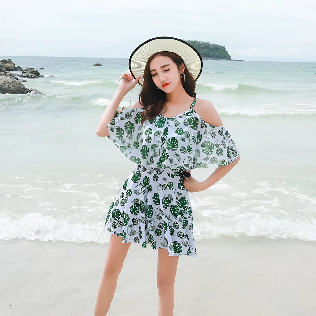 Women's printed one-piece swimsuit in polyester fabric showing green leaf style and black letter style colour options