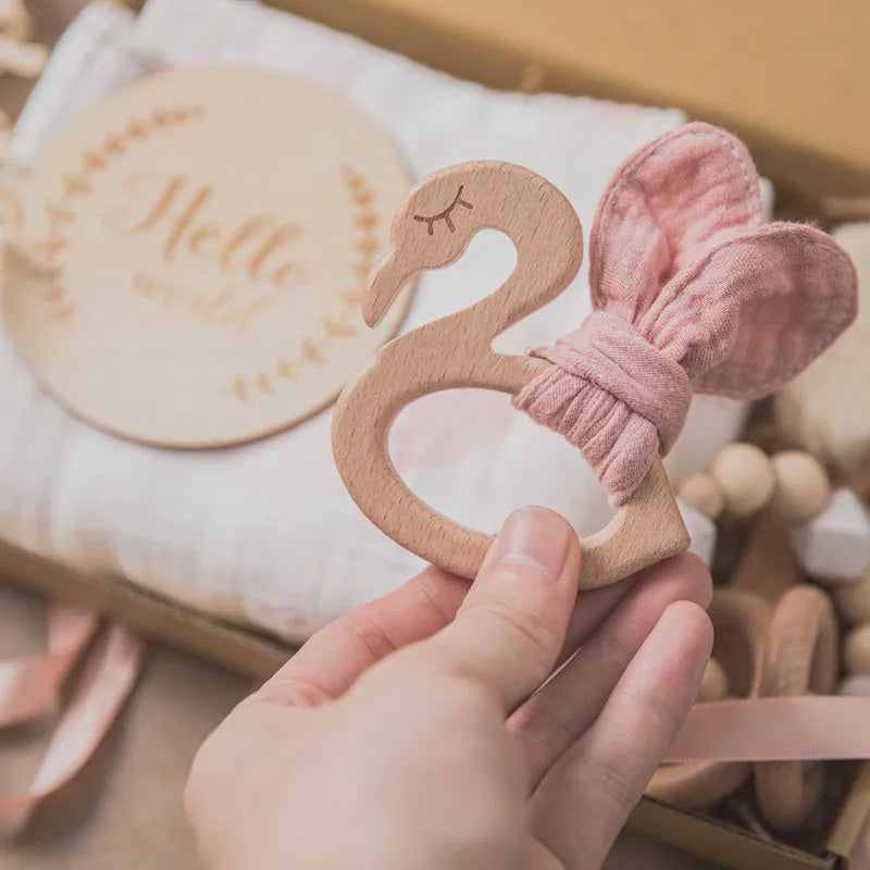 Newborn baby shower toy set in peach colour, six bath toys made from wood and chemical fibre