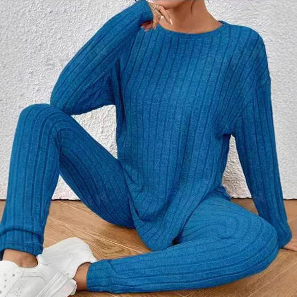 Black sunken stripe two-piece polyester homewear set with regular sleeves, showing top and pants.