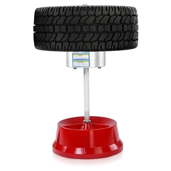 Portable aluminium hub balancer for car wheels with a bull's eye level and enamel-finished base.