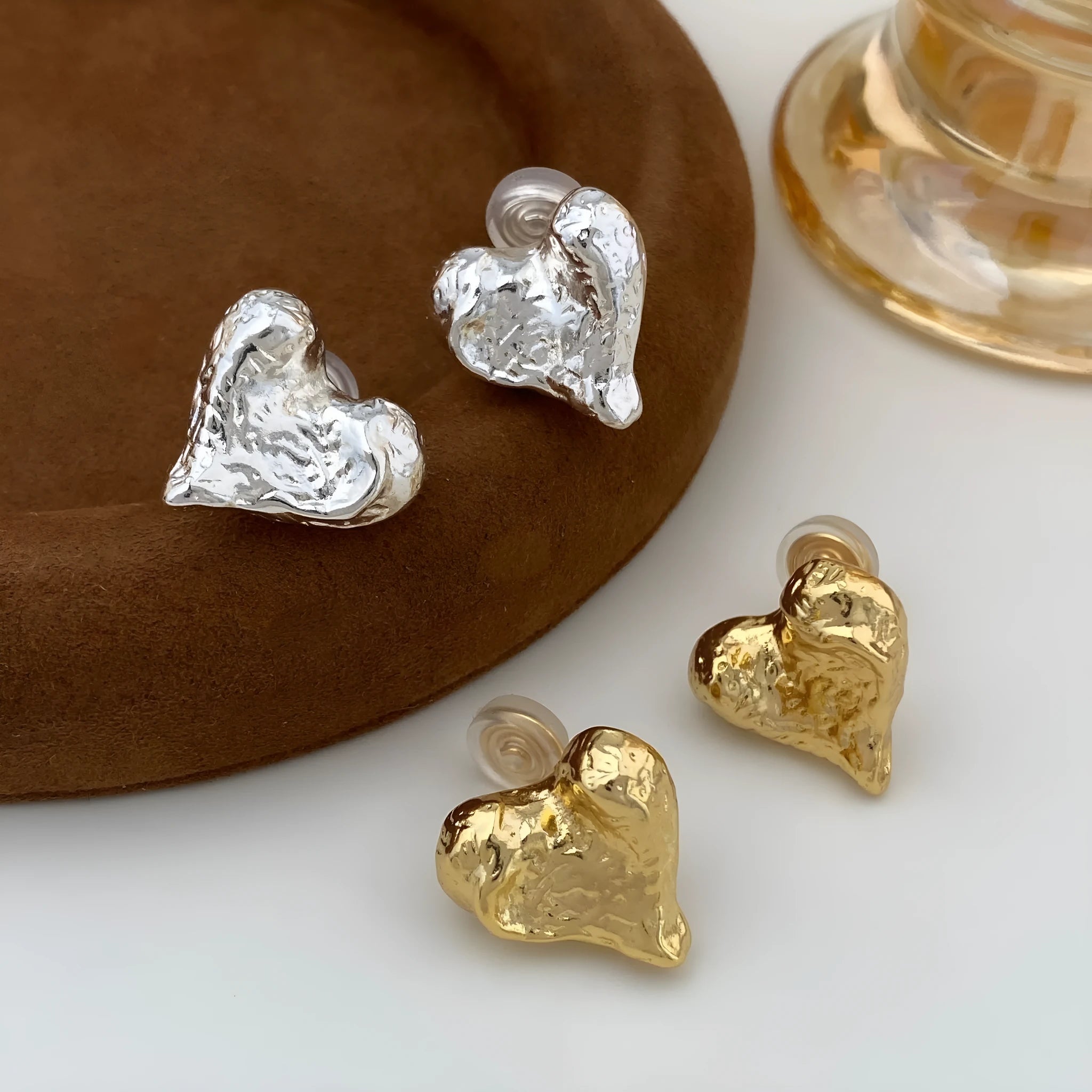 Minimalist silver heart-shaped stud earrings for women on copper base