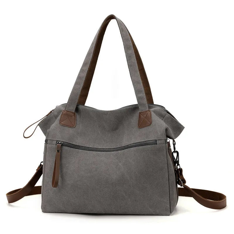 Women's retro style canvas shoulder bag in horizontal square shape with organisational compartments