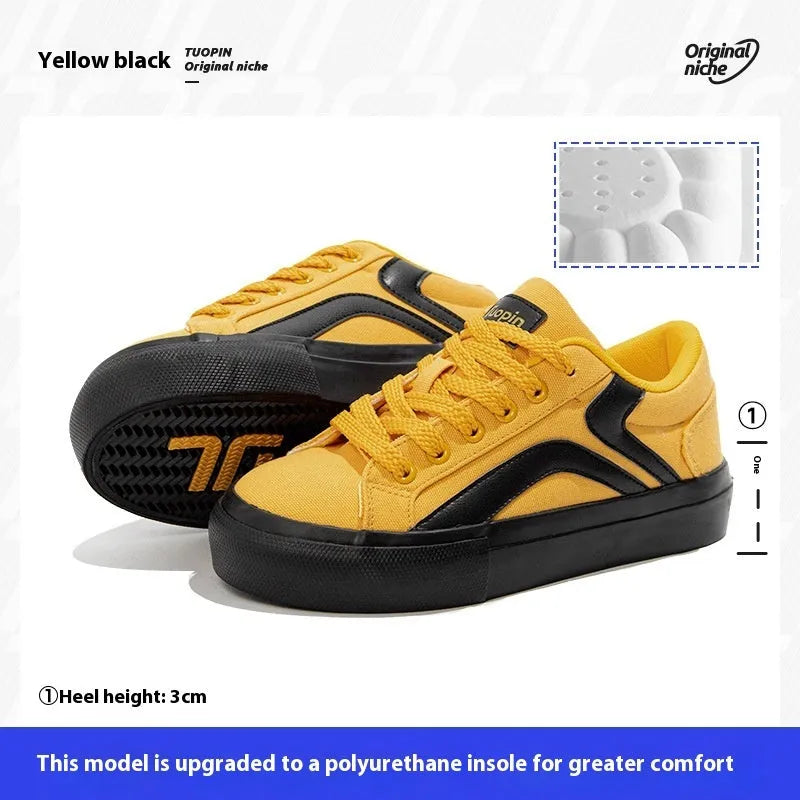 Women's low-top vulcanised board shoes in a black and white colourway with round toe and lace-up front.