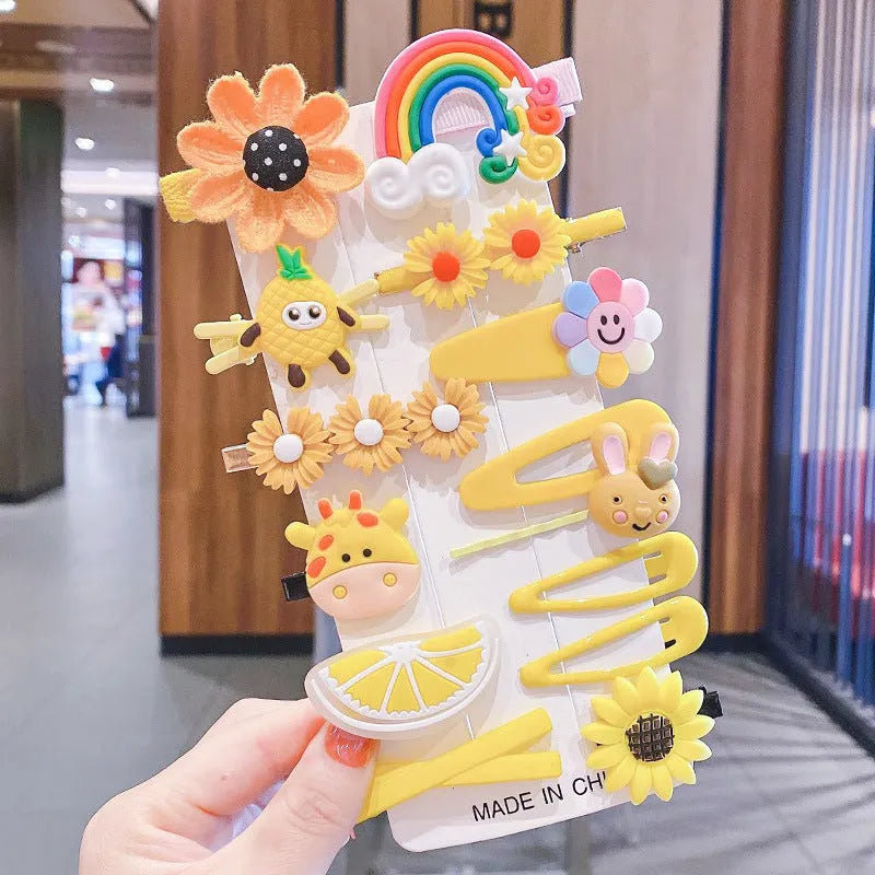 14-piece toddler hair clips set with rainbow barrettes, candy fruit, butterfly, and ice cream patterns on white background