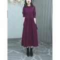 A purplish red plus size women's long sleeve dress with a long skirt for autumn and winter.